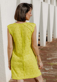 Woman wearing the Daïquiri Dress sewing pattern from Maison Fauve on The Fold Line. A sleeveless dress pattern made in viscose, soft jacquard, tencel, cotton, crepe, poplin, satin or twill, lace, or guipure fabric, featuring decorative yokes, a round neck