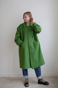 Woman wearing the Darcy Coat sewing pattern from The Modern Sewing Co on The Fold Line. A coat pattern made in wool, waxed cotton, linen/hemp, gabardine, denim fabrics featuring an oversized fit, dropped shoulder, deep armholes, wide sleeves, wide main bo