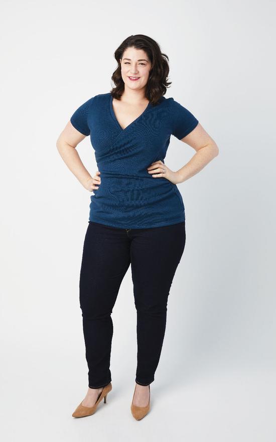 Woman wearing the Dartmouth Top sewing pattern from Cashmerette on The Fold Line. A wrap top pattern made in mid-weight knit fabric, such as cotton or rayon jersey with at least 50% stretch or light to mid-weight sweater knits fabrics, featuring a V-neck,