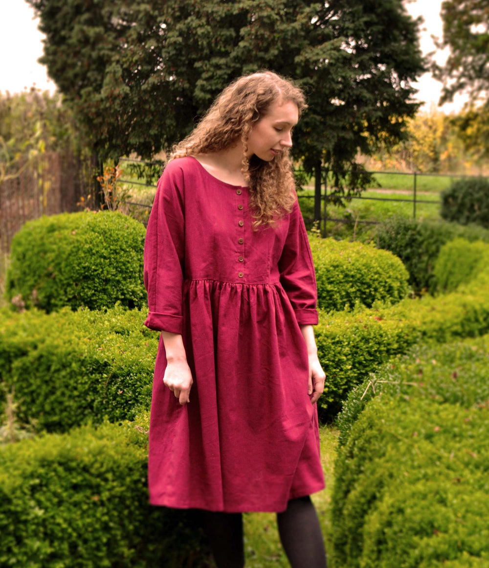 Woman wearing the Daydreamer Dress sewing pattern from Stitched in Wonderland on The Fold Line. A dress pattern made in cotton poplin, viscose, linen, silk, brushed cotton or flannel fabric, featuring a relaxed fit, in-seam pockets, knee length hem, gathe