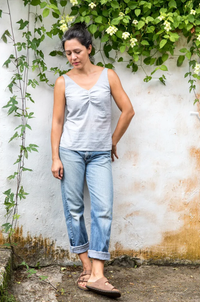 Woman wearing the Delpy Ballet Top and Dress sewing pattern from Halfmoon Atelier on The Fold Line. A ballet/camisole top pattern made in double gauze, cotton lawn, rayon, linen, satin, silk or velvet fabrics, featuring a V-neck with bust gather, looser a