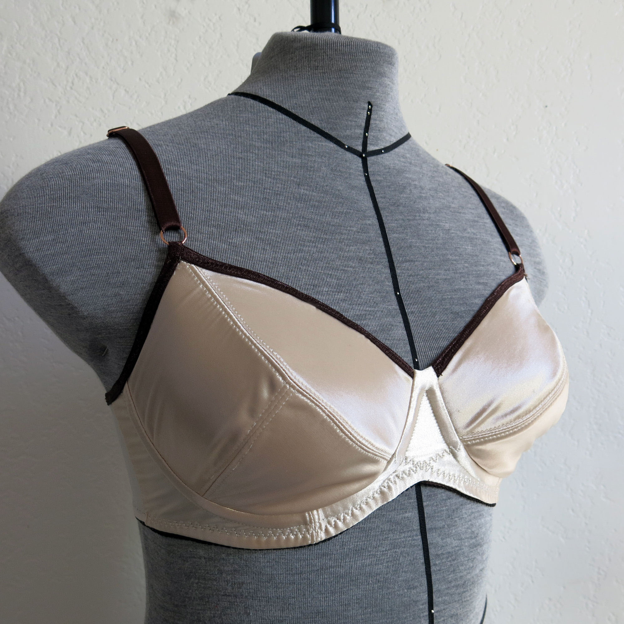 Mannequin wearing the Desiree Bra sewing pattern from Primrose Dawn on The Fold Line. A bra pattern made in low stretch knit fabrics, featuring full-coverage, underwiring, three-piece cup and gothic arch bridge.