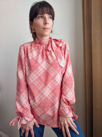 Woman wearing the Donna Blouse and Dress sewing pattern from Camimade on The Fold Line. A wrap blouse pattern made in chiffon, georgette, crepe de chine, rayon, sandwashed silk, modal, cotton lawn, cotton shirting, poplin, linen, viscose fabrics, featurin