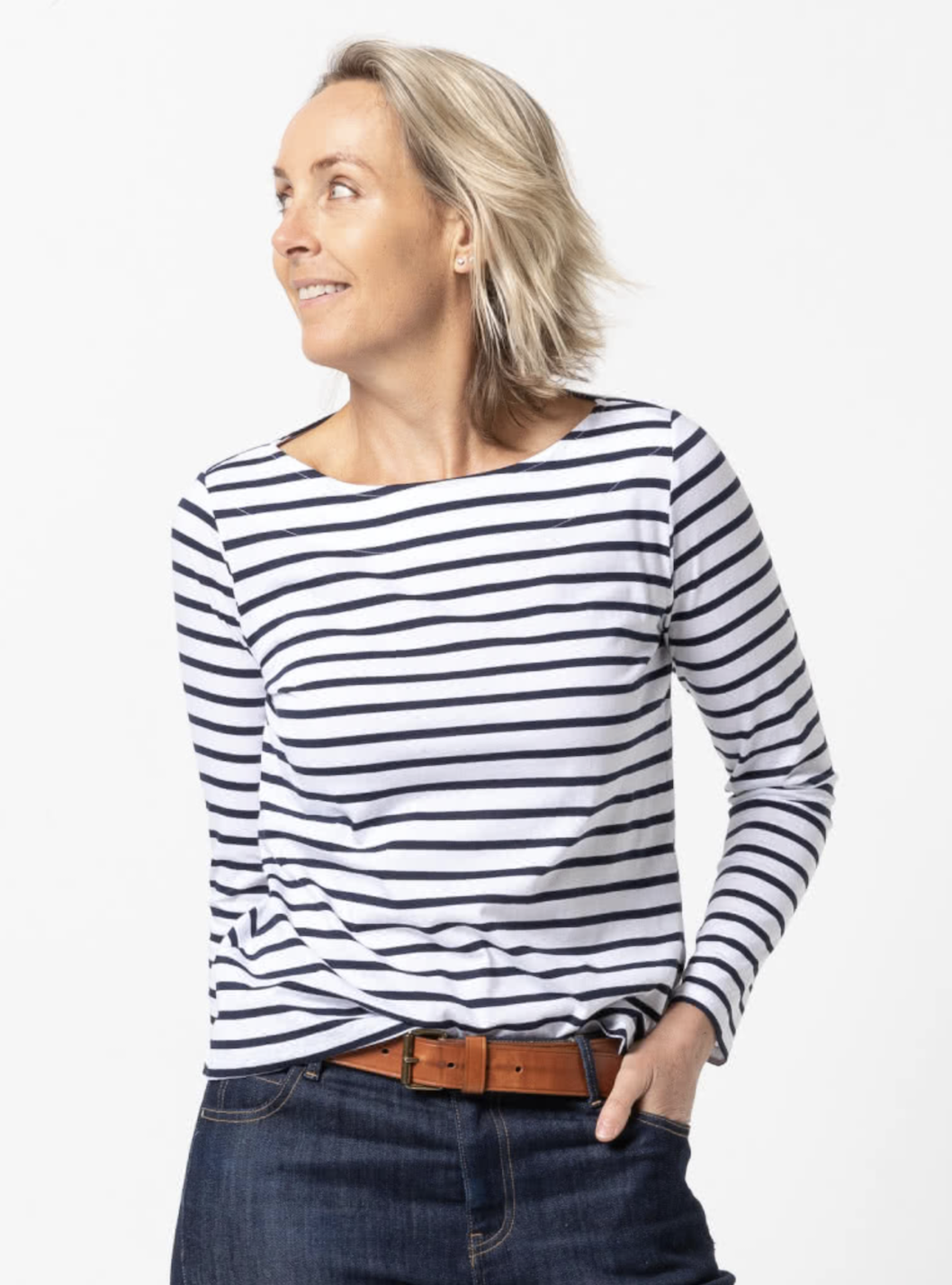 Woman wearing the Ellis Knit Tee sewing pattern from Style Arc on The Fold Line. A T-shirt pattern made in cotton knit or jersey fabric, featuring a boat neck and long sleeves.