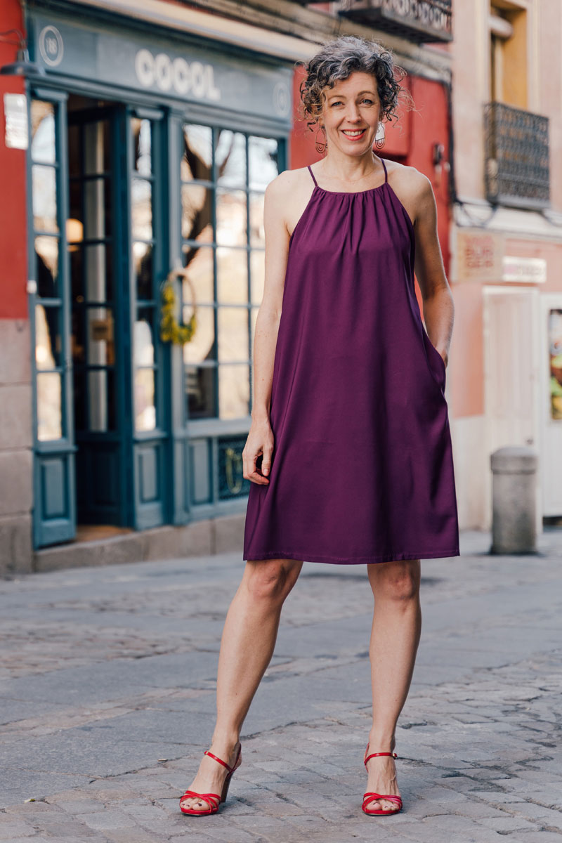 Woman wearing the Enmore Halter Dress and Top sewing pattern from Liesl + Co on The Fold Line. A dress pattern made in cotton poplin, linen, rayon, lawn, voile or silk satin fabrics, featuring a halter-neck, narrow straps, built-in bra and in-seam pockets