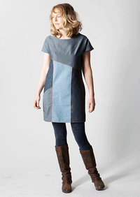 Woman wearing the Essential Denim Dress sewing pattern from Sew Different on The Fold Line. A shift dress pattern made in denim, heavy cotton, scuba or linen fabrics, featuring cap sleeves, round neck, diagonal bust line, diagonal pocket and above knee le