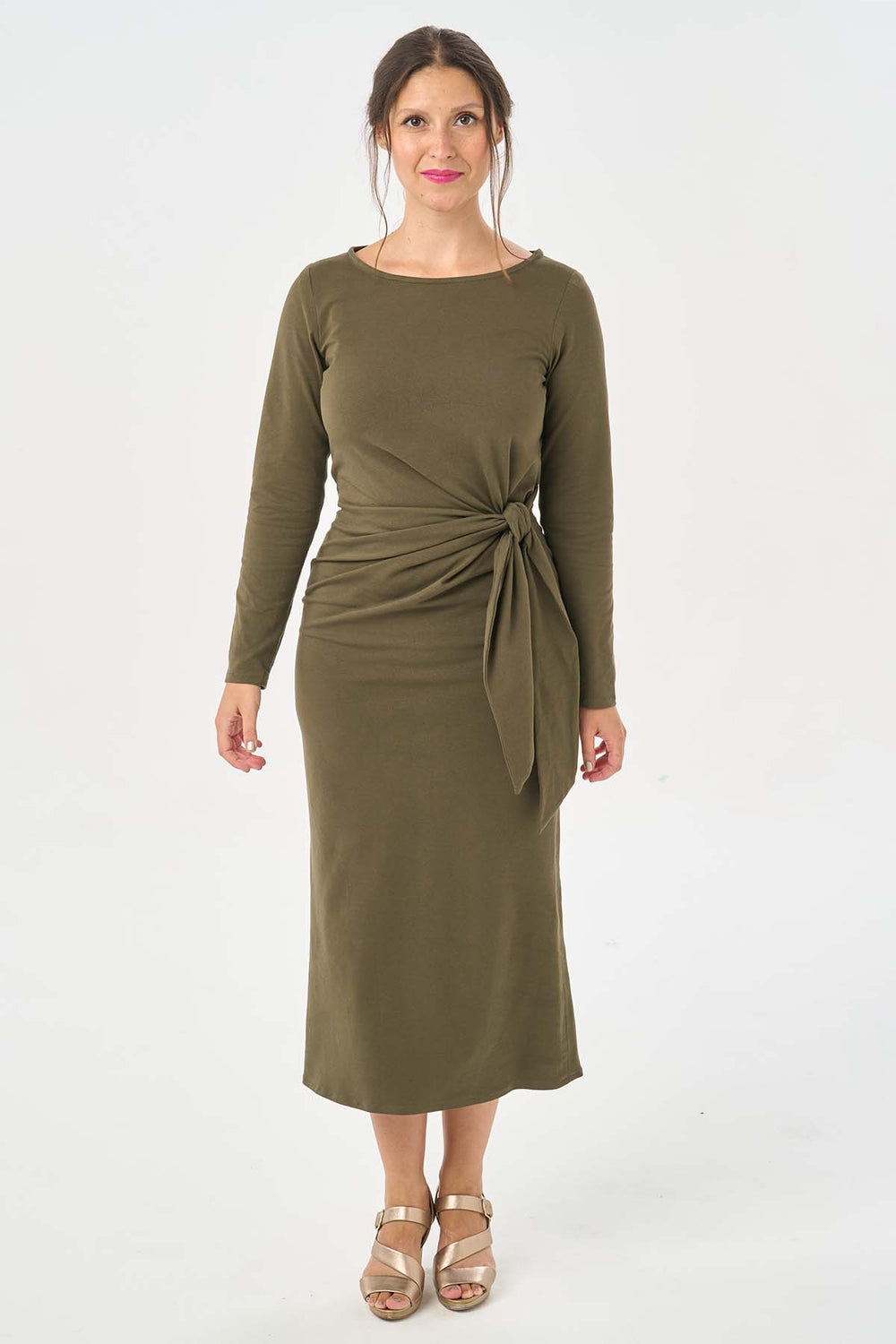 Woman wearing the Estelle Dress sewing pattern from Sew Over It on The Fold Line. A knit dress pattern made in viscose or bamboo jersey, French terry or lightweight cotton jersey fabrics, featuring a midaxi length, full length sleeves, straight skirt, boa