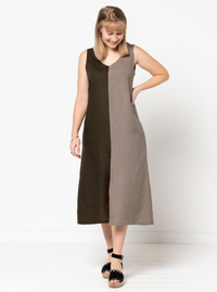 Woman wearing the Esther Woven Dress sewing pattern from Style Arc on The Fold Line. A Dress pattern made in washed linen, rayon, cotton or crepe fabrics, featuring a slip-on style, sleeveless, midi length, A-line shape, front and back V-necklines, centre