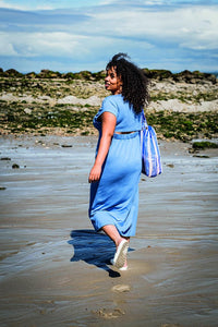 Women wearing the Alena Dress sewing pattern from Fibre Mood on The Fold Line. A dress pattern made in bamboo French terry, viscose jersey, French terry, double gauze or chambray fabrics, featuring a round neckline, short sleeves, at the back elastic brin