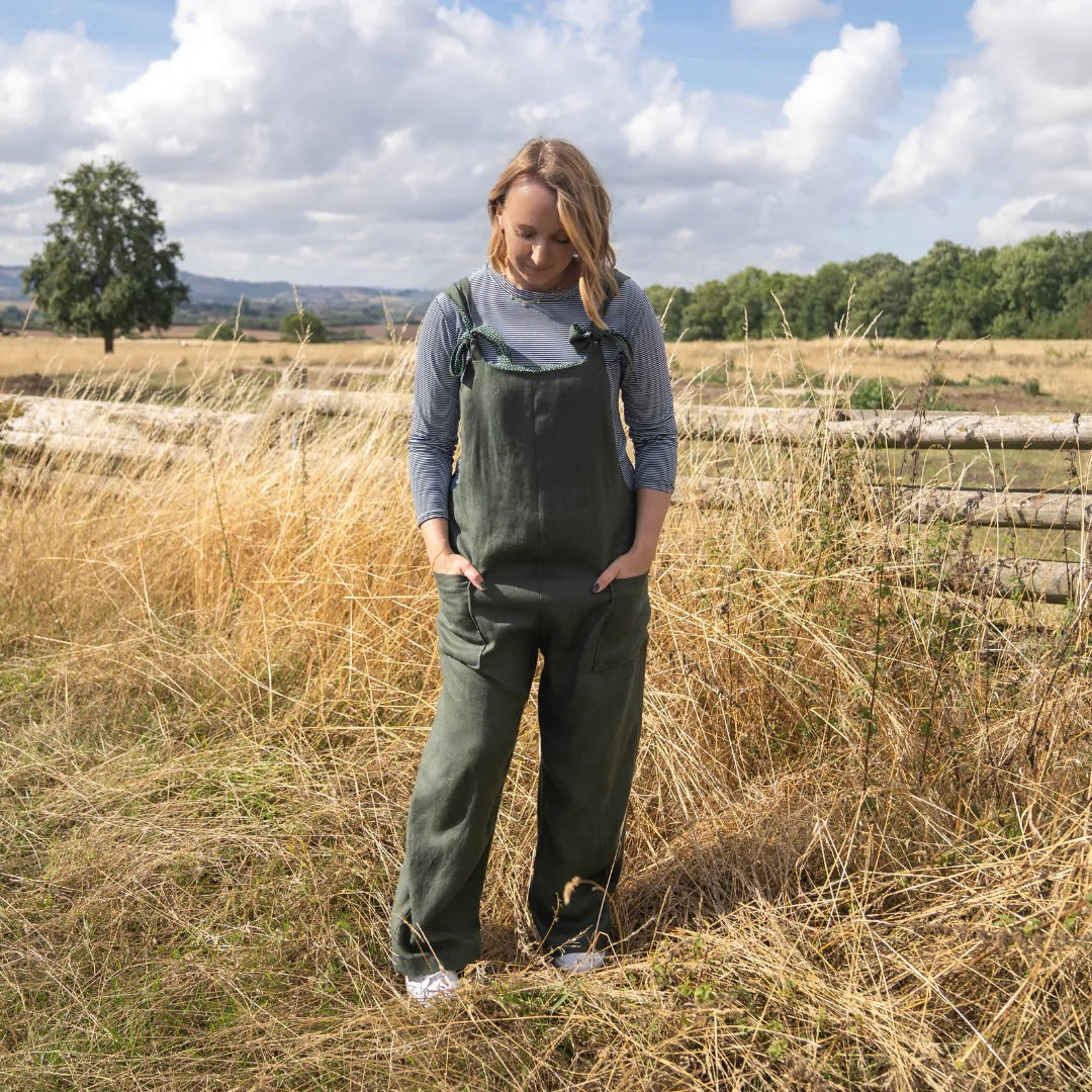 Woman wearing the Ferdi Dungarees sewing pattern from Sew Me Something on The Fold Line. A dungarees pattern made in medium to light weight cotton, light weight denim, linen, corduroy, double gauze or medium to heavy weight viscose fabrics, featuring a re