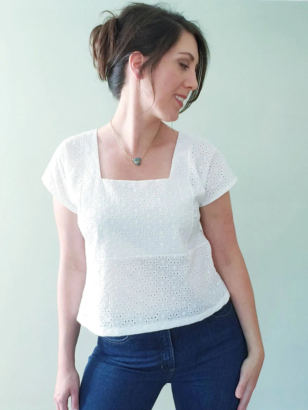 Woman wearing the Fern Top Expansion Pack sewing pattern from Pattern Scout on The Fold Line. A top pattern made in linen, chambray, poplin, voile, tencel, rayon challis, or crepe de chine fabric, featuring a boxy fit, square neck, and grown-on short slee