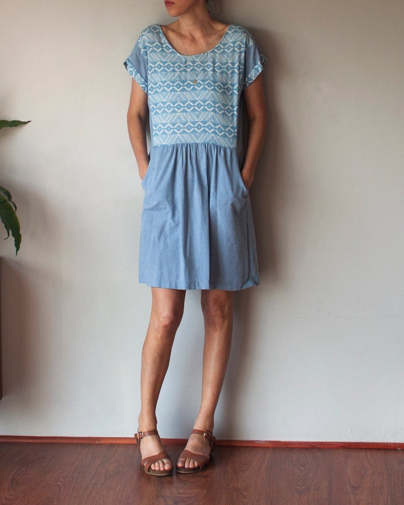 Woman wearing the Forsythe Dress sewing pattern by French Navy. A dress pattern made in challis, chambray, cotton shirting, flannel, lightweight linen blends, viscose or rayon fabrics, featuring a relaxed fit, yoke pockets, slightly dropped waistline, gro