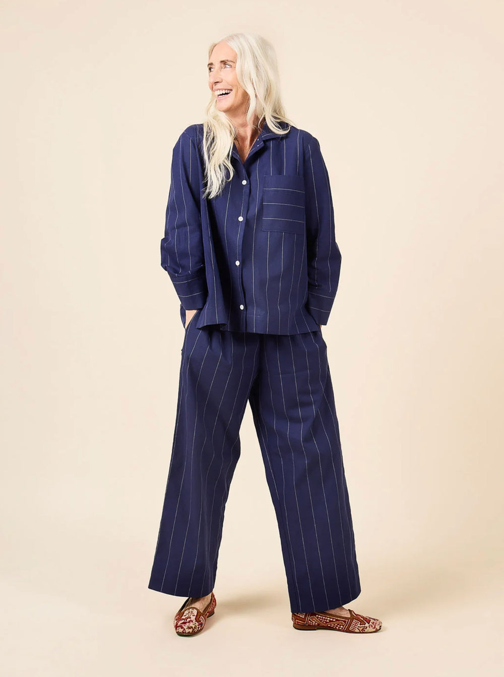 Woman wearing the Fran Pajamas sewing pattern from Closet Core Patterns on The Fold Line. A pyjama pattern made in broadcloth, voile, poplin, chambray, cotton flannel, linen, silk crepe de chine, satin, rayon challis or viscose fabrics, featuring a relaxe