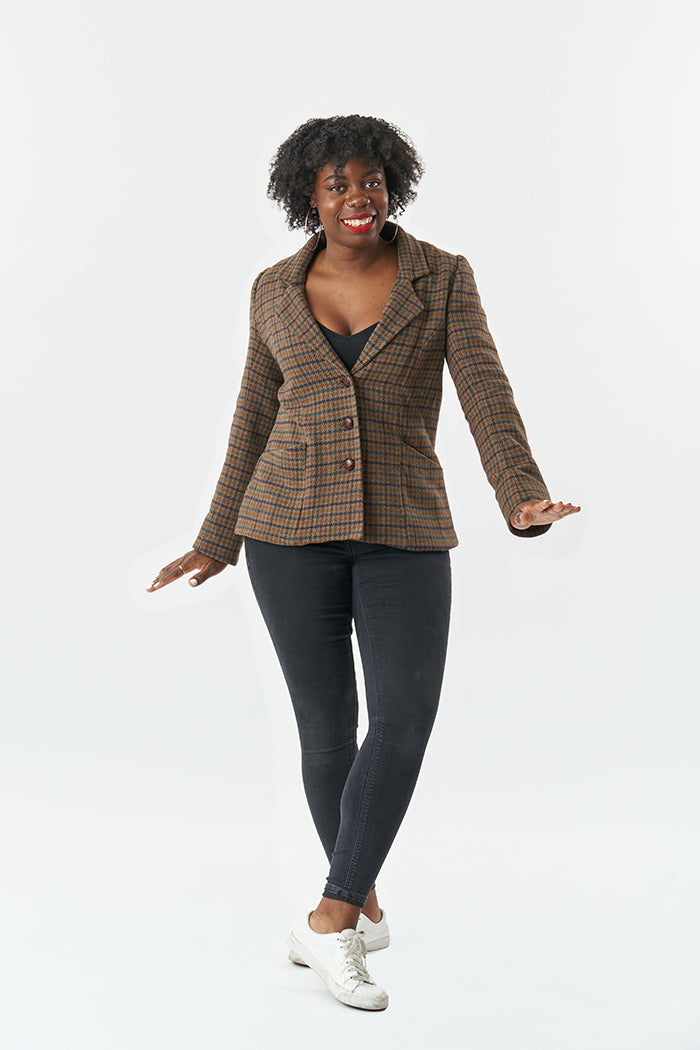 Woman wearing the Francine Jacket sewing pattern from Sew Over It on The Fold Line. A jacket pattern made in boiled wool, melton, boucle, wool blend coatings and suiting fabrics, featuring a notched collar, slanted pockets inserted into the front panels, 