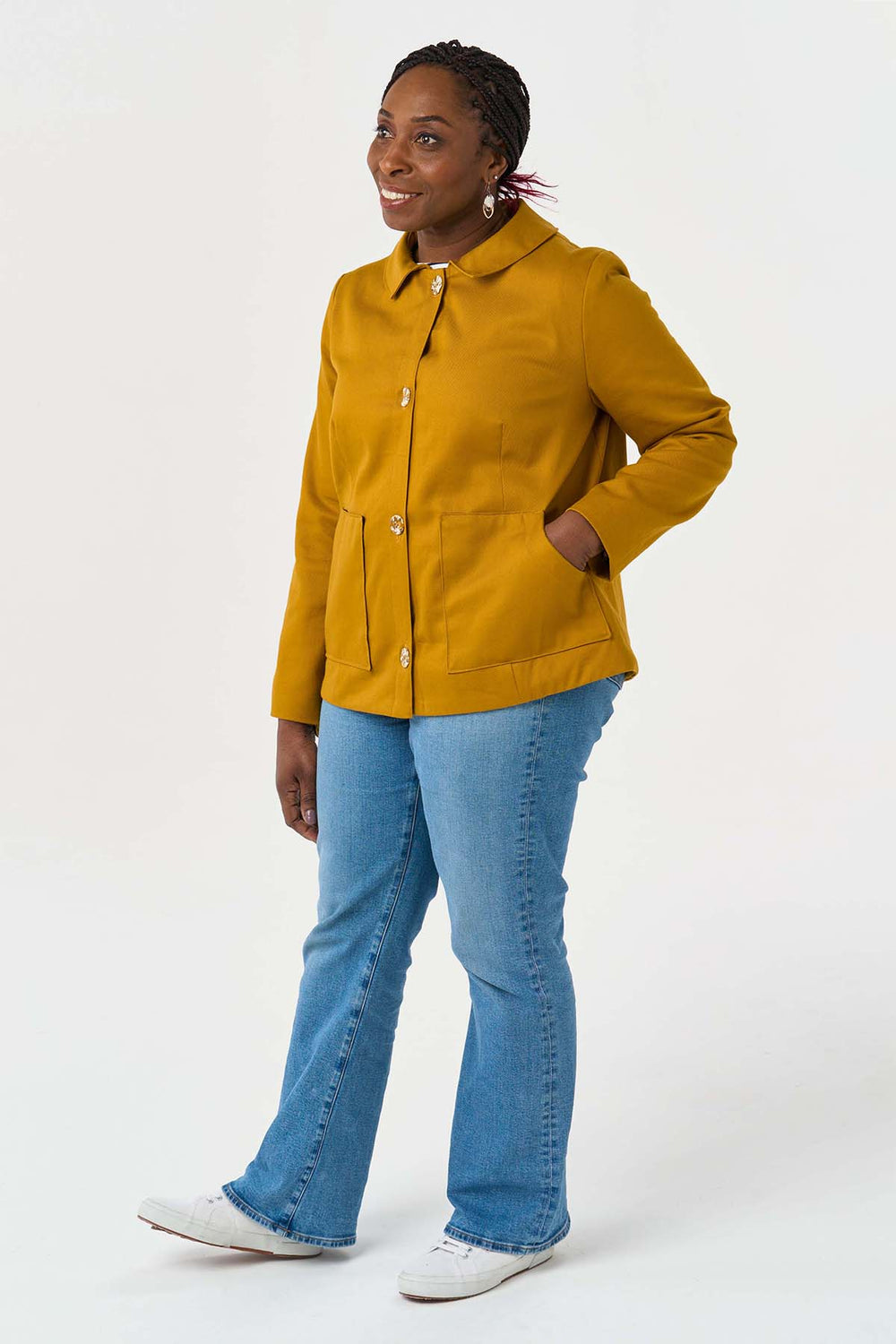 Woman wearing the Frankie Jacket sewing pattern from Sew Over It on The Fold Line. A jacket pattern made in twill, corduroy, denim, canvas, melton, jacquard and boiled wool fabrics featuring a boxy silhouette, sharp collar with partial collar stand, darte