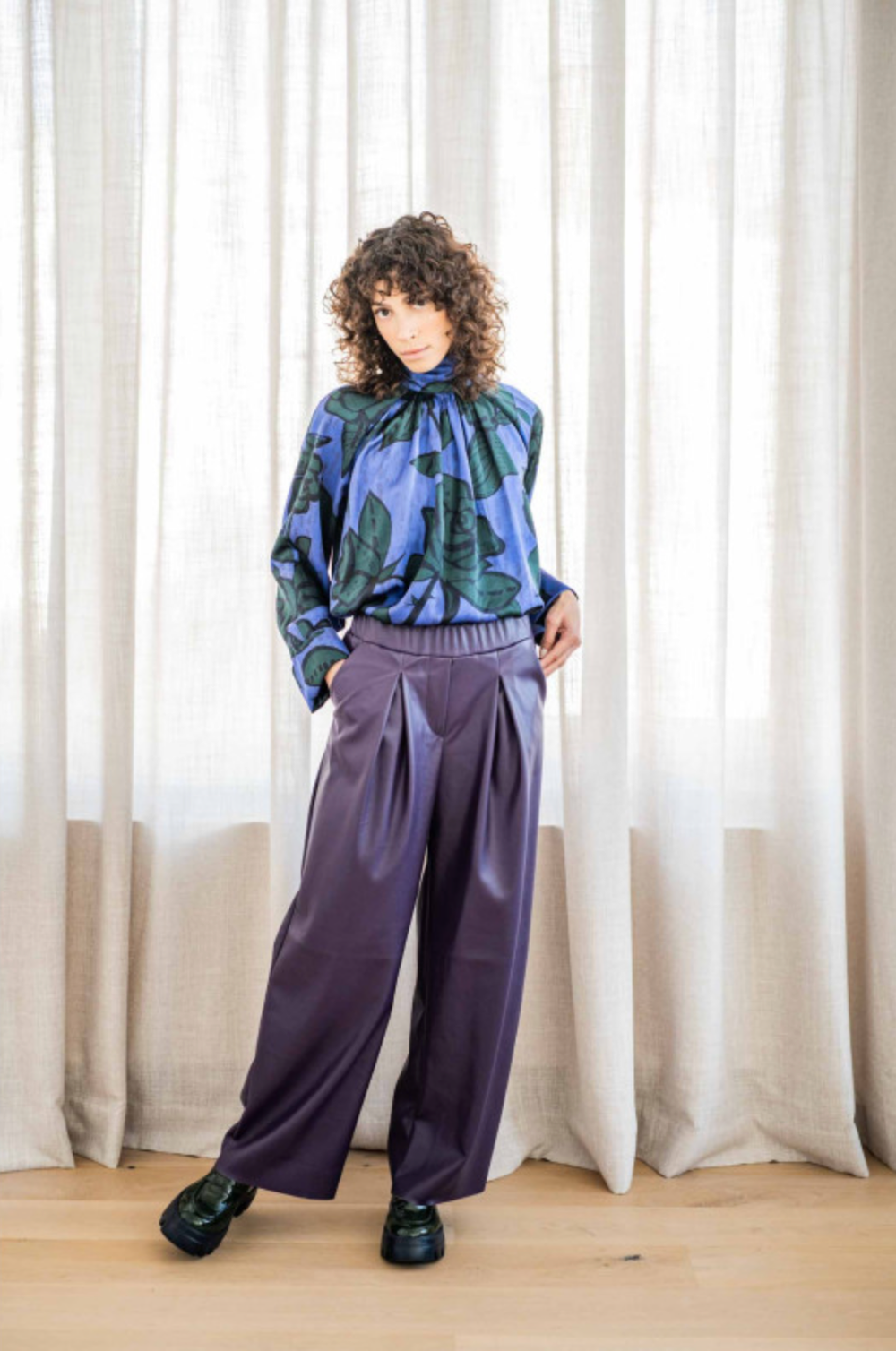 Woman wearing the Freja Trousers sewing pattern from Fibre Mood on The Fold Line. A trouser pattern made in poplin, denim, viscose (crepe), woollen crepe, gabardine, satin, velvet, French terry, sweatshirting and jacquard fabrics, featuring a wide legs, f