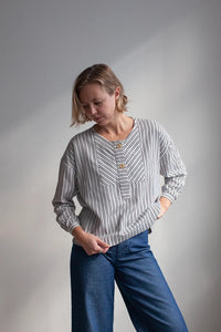 Woman wearing the French Smock sewing pattern from The Modern Sewing Co on The Fold Line. A top pattern made in linen, poplin, lawn, lightweight denim, twill, corduroy, denim, wool suiting or lightweight wool felt jersey fabrics, featuring a slouchy overs