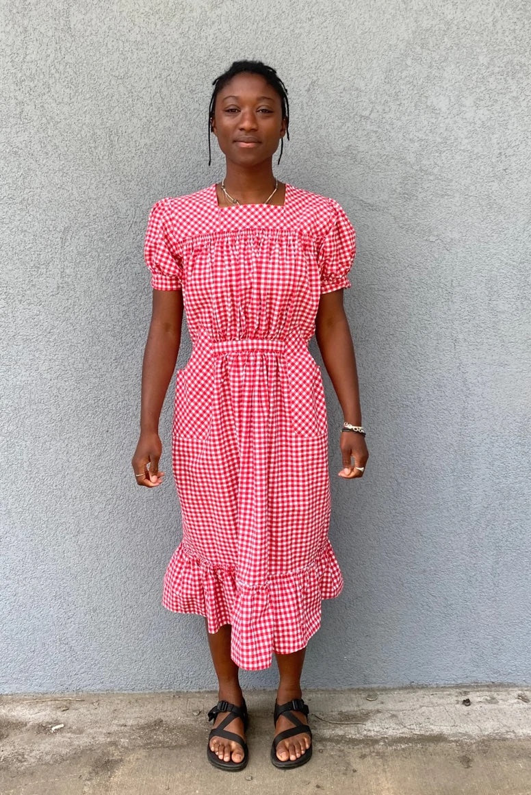 Woman wearing the 121 Guatemalan Gabacha sewing pattern from Folkwear on The Fold Line. A dress pattern made in cottons, rayon, linen or silk fabrics, featuring puffed sleeves with narrow straight cuff, centre back zipper, gathered at the front waist with