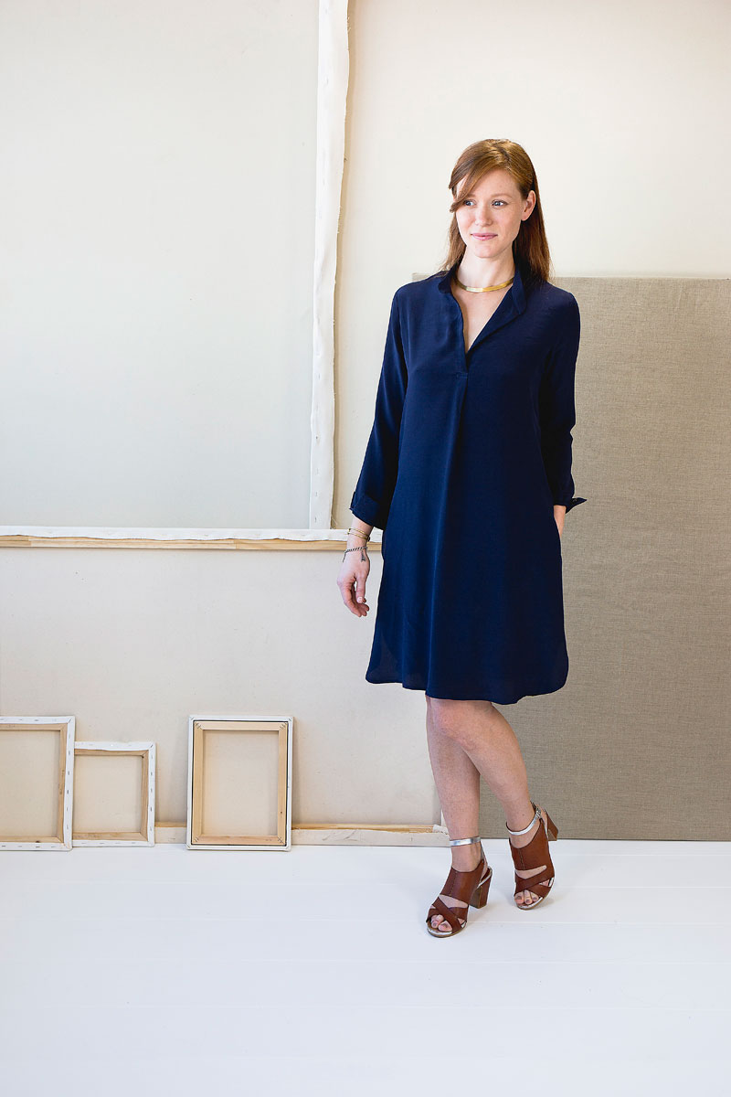 Woman wearing the Gallery Dress sewing pattern from Liesl + Co on The Fold Line. A dress pattern made in sateen, double gauze, shirting, voile, lawn, rayon, and silk fabrics, featuring a relaxed fit, in-seam pockets, button-cuff full-length sleeves, band 