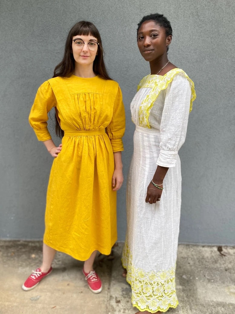 Women wearing the 220 Garden Party Dresses sewing pattern from Folkwear on The Fold Line. A dresses pattern made in cotton batiste, voile, lawn, gauze, eyelet, rayon challis, silks or wool challis fabrics, featuring a self-bias bound jewel neckline, self-