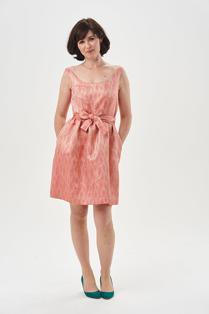 Woman wearing the Grace Dress sewing pattern from Sew Over It on The Fold Line. A sleeveless dress pattern made in cotton, cotton lawn, cotton poplin, cotton twill, brocade, jacquard, wool suiting, triple crepe or Rio crepe fabric, featuring a wide scoope