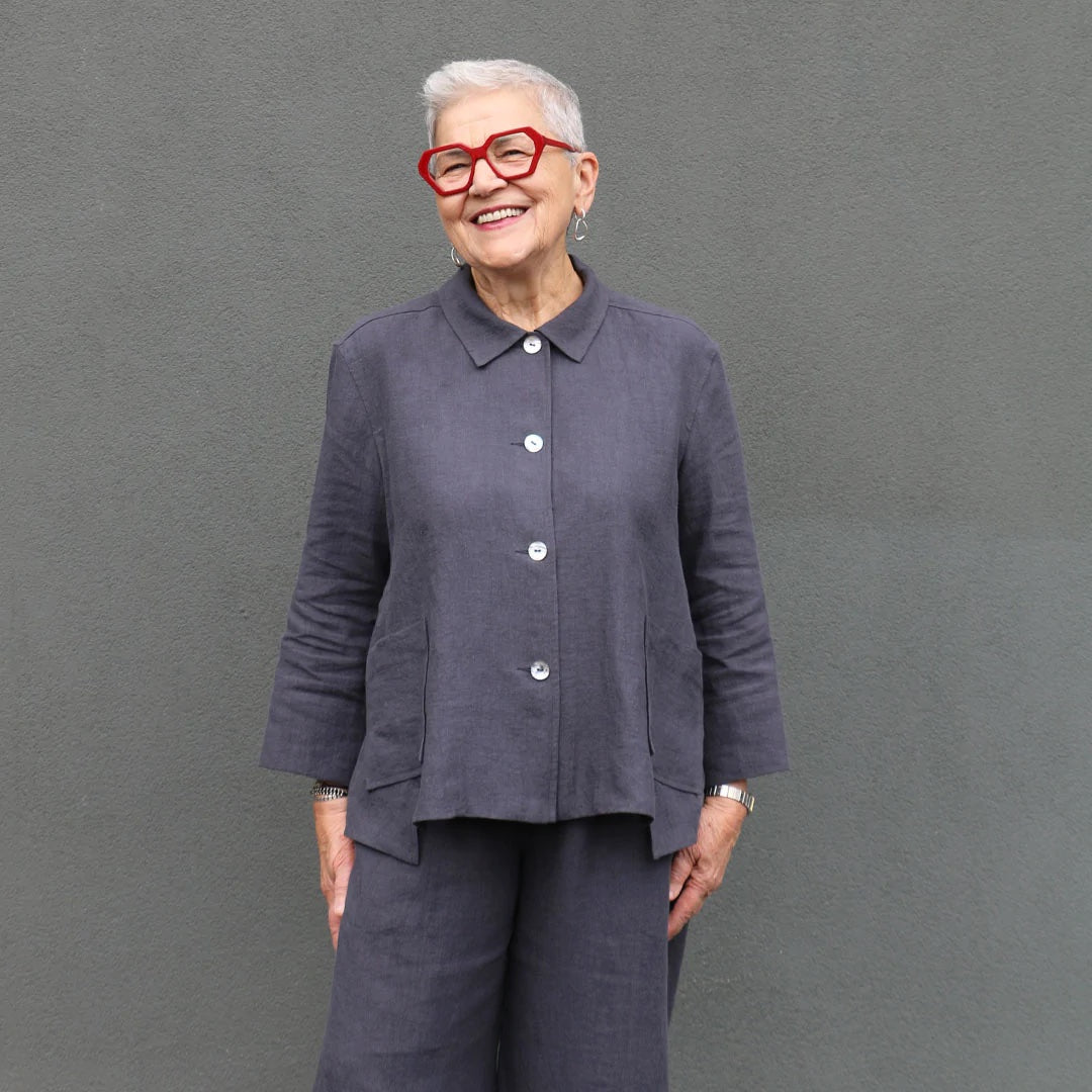 Woman wearing the Harlow Shirt sewing pattern from Tessuti Fabrics on The Fold Line. A shirt pattern made in cotton, linen, pinwale corduroy, lightweight denim, wool crepe or firm silk fabrics, featuring a hip length, front button closure, relaxed fit, ba