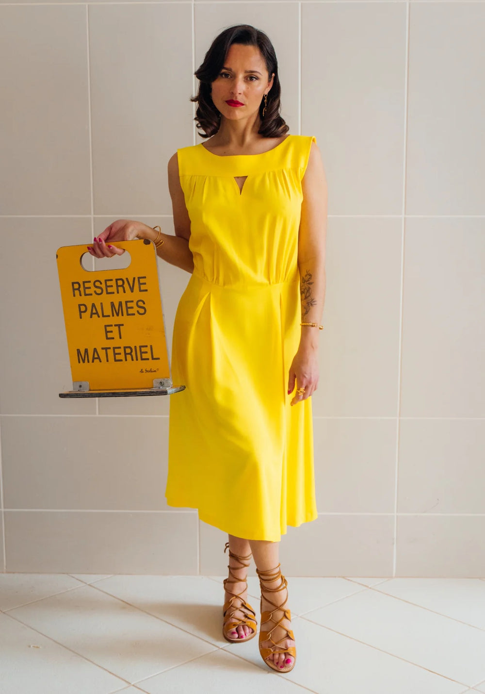 Woman wearing the Haut Vol Dress sewing pattern from Maison Fauve on The Fold Line. A dress pattern made in viscose, tencel, cotton, crepe, poplin, satin or twill fabrics, featuring a scoop neckline, yoke with gathers and front cut-out, skirt with two sti
