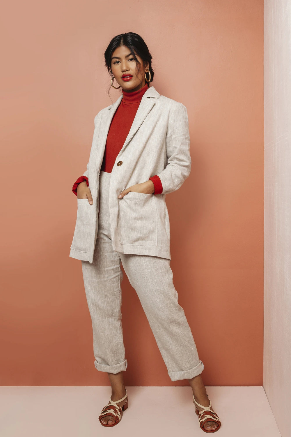 Woman wearing the Heather Blazer sewing pattern by Friday Pattern Company. A blazer pattern made in linen, suiting, twill, denim or canvas fabric featuring a slightly oversized fit, single button closure, front patch pockets and lapel collar.