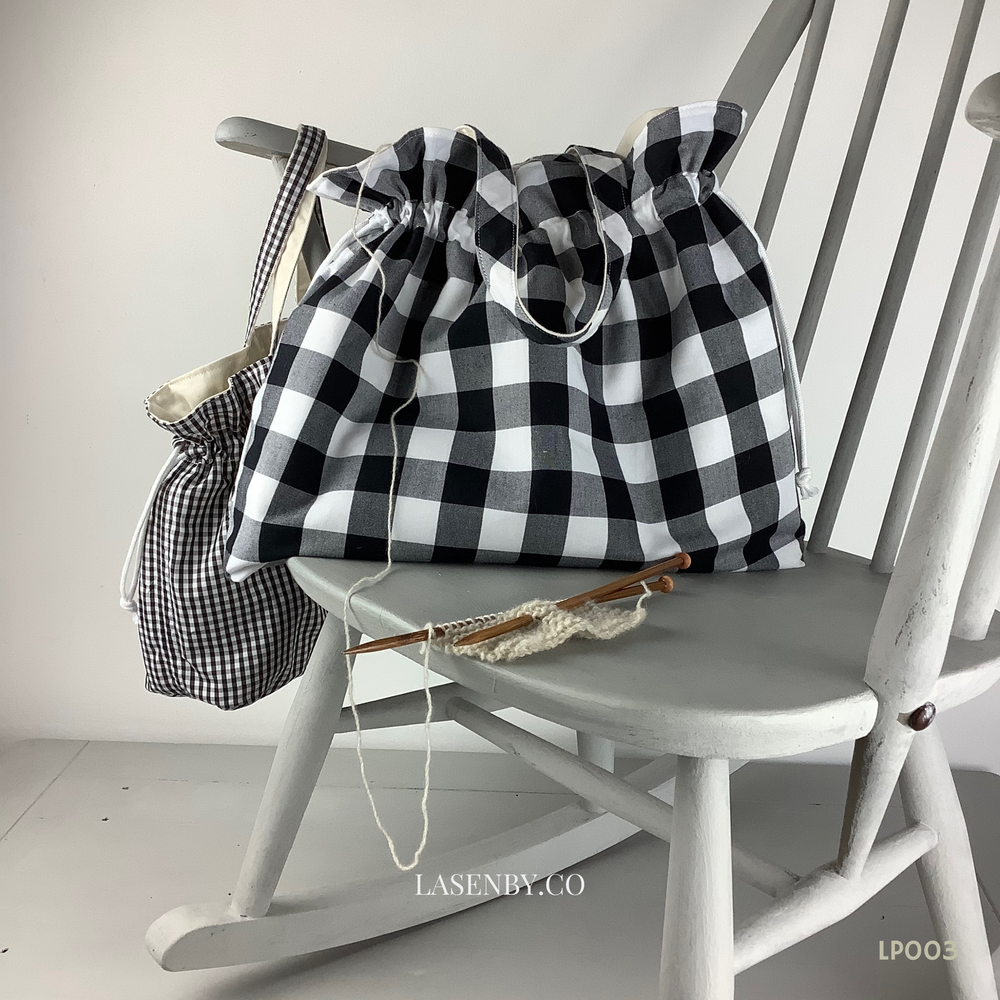 Photo showing the Hebe Project Bag sewing pattern from Lasenby on The Fold Line. A tote bag pattern made in canvas, linen, quilting cotton, twill, duck, denim, upholstery and thinner tweed fabrics, featuring two size options, two handle lengths, multiple 