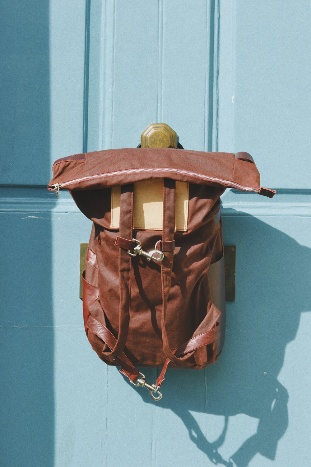 Image showing the Hilda Bag sewing pattern from Made My Wardrobe on The Fold Line. A bike pannier or backpack pattern made in strong water resistant fabrics, featuring zip closure, shoulder straps, front waist and chest clip fastenings and side pockets.