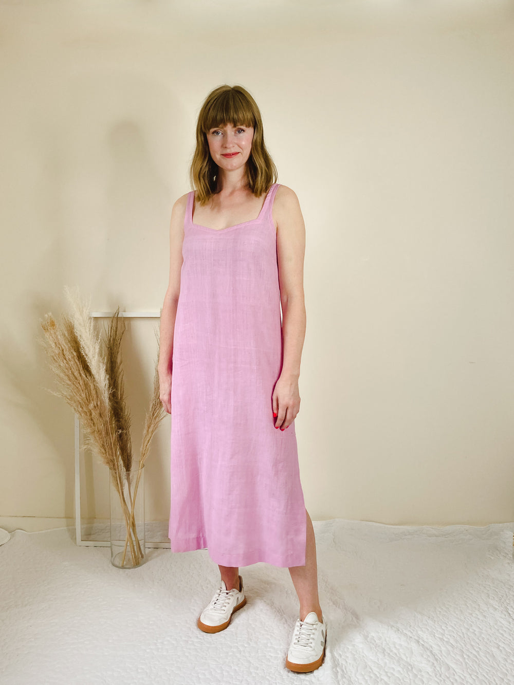 Woman wearing the Innes Cami Dress sewing pattern from Homer and Howells on The Fold Line. A cami dress pattern made in linen, cotton, crepe, double gauze, jacquards, silks, viscose or bamboo fabrics, featuring a straight silhouette, narrow shoulder strap