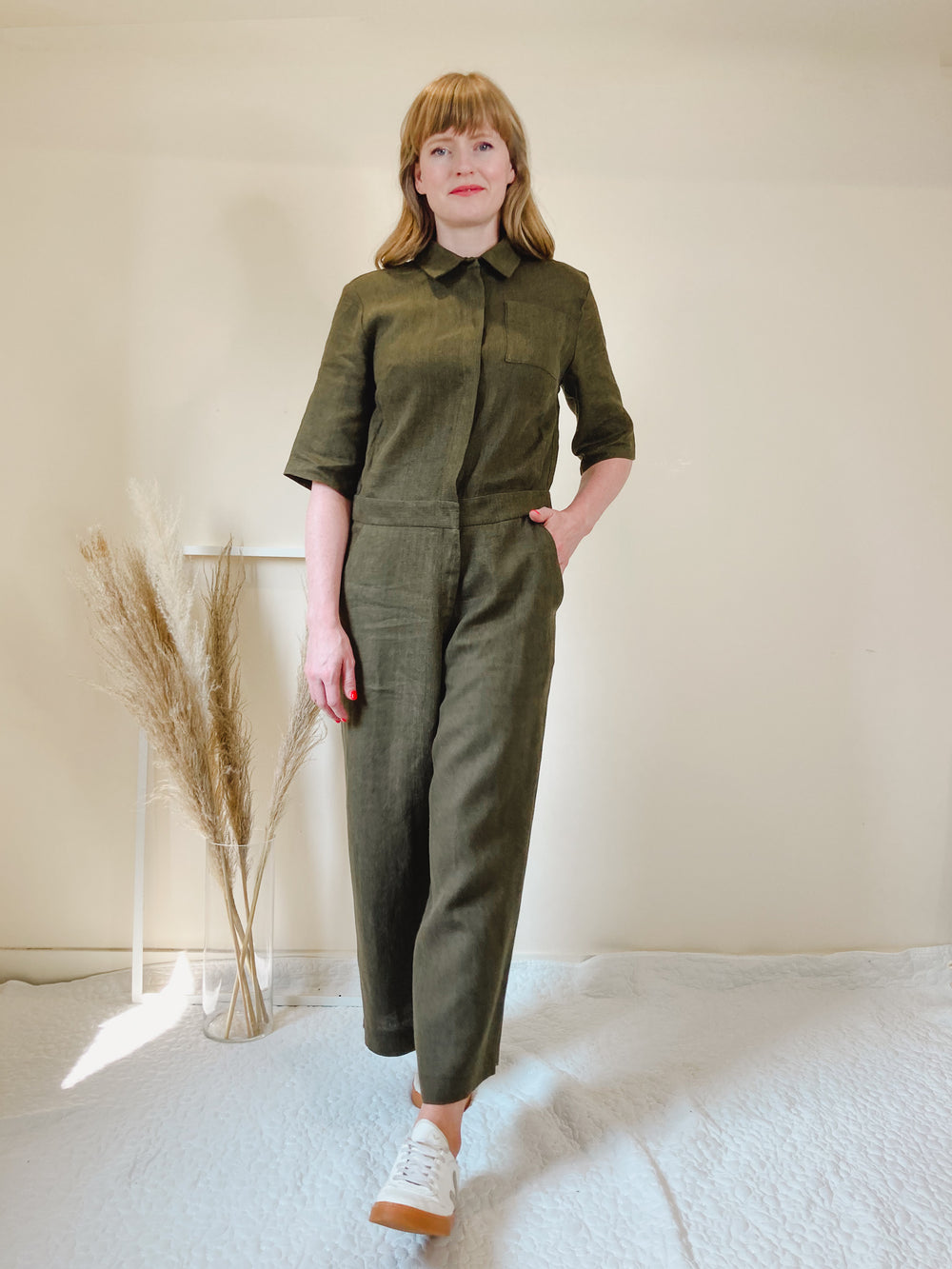 Woman wearing the Lennox Boilersuit pattern from Homer and Howells on The Fold Line. A boilersuit pattern made in linen, cottons, denim, baby cord, crepe, viscose twills, medium weight cotton or viscose lawns, tencels or cotton drill fabrics, featuring a 