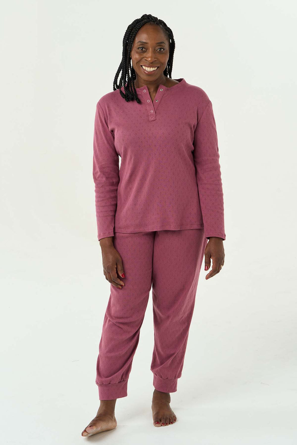 Woman wearing the Imogen Pyjamas sewing pattern from Sew Over It on The Fold Line. A Pyjamas pattern made in viscose or bamboo jersey, French terry or lightweight cotton jersey fabrics, featuring bottoms with elasticated waistband, full length leg with na
