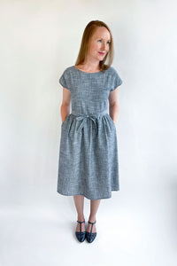 Woman wearing the Isla Wrap Dress sewing pattern from Jennifer Lauren Handmade on The Fold Line. A wrap dress pattern made in cotton lawn, voile, poplin, linen, light chambray, denim, sateen, rayon, silks or crepes fabrics, featuring waistline darts, grow