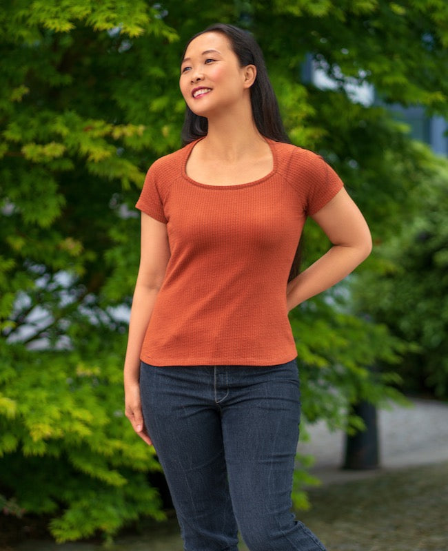 Woman wearing the Glenelly Top sewing pattern from Itch to Stitch on The Fold Line. A knit top pattern made in cotton spandex jersey, poly spandex jersey or interlock fabrics, featuring a square neck, raglan short sleeves.