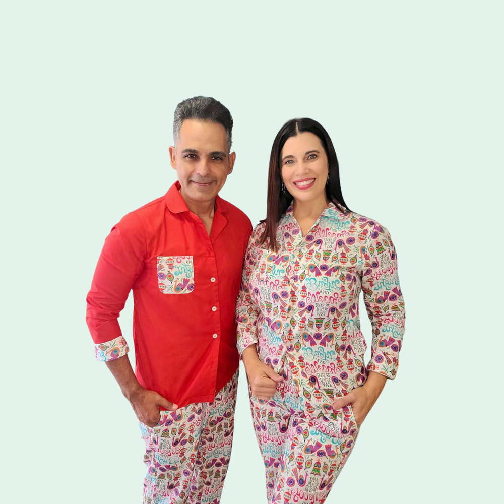 Man and Woman wearing the Unisex James Pyjamas sewing pattern from Sirena Patterns on The Fold Line. A pyjama pattern made in cotton flannel, linen, quilting cottons, rayon challis, silk crepe or charmeuse fabrics, featuring a loose-fit, button-front clos