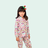 Child wearing the Child/Teen Jamie Pyjamas sewing pattern from Sirena Patterns on The Fold Line. A Unisex PJ’S pattern made in cotton flannel, linen, quilting cottons, rayon challis, silk crepe or charmeuse fabrics, featuring a loose-fit, button-front shi