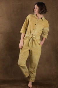 Woman wearing the Jean-Paul Boiler Suit sewing pattern from Ready to Sew on The Fold Line. A boilersuit pattern made in denim, twill, canvas, gabardine, linen, cotton or wool flannel, chambray, poplin or sateen fabrics, featuring extra add-ons such as a f