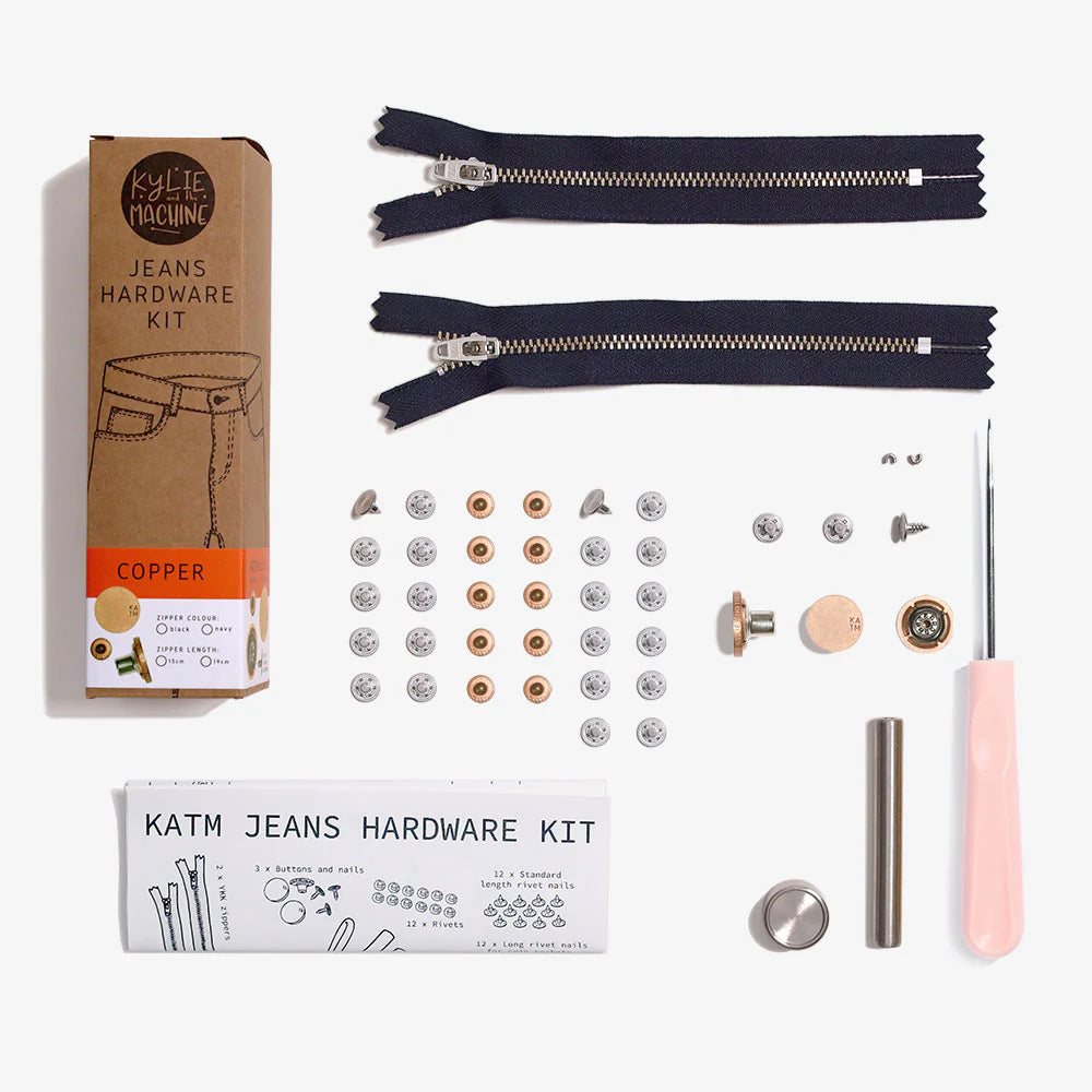 Photo showing the Jeans Hardware Kit from Kylie & The Machine on The Fold Line. The kit includes hardware for 2 pairs of jeans. 2 x YKK locking jeans zippers, 2 x zipper "top stops" for use in shortening the zipper, 3 x jeans buttons and nails, 12 x rivet