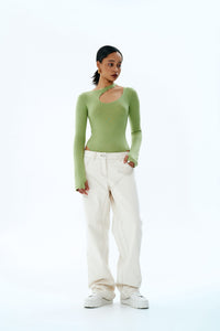 Woman wearing the Jewel Pants sewing pattern from Vikisews on The Fold Line. A trouser pattern made in denim or corduroy fabrics, featuring a loose-fit, straight-cut, topstitching, belt loops, faux side pockets, back yoke with patch pockets, fly front zip