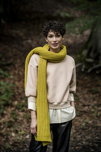 Woman wearing the Jo Top sewing pattern from Fibre Mood on The Fold Line. A jumper pattern made in French terry, sweatshirt fabric, rib knits or knit jacquard fabrics, featuring ¾ length balloon sleeves, relaxed fit, neck binding, wrist trim and hem band.