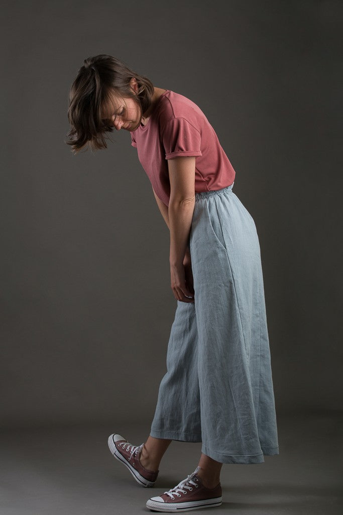Woman wearing the Joanne Culottes sewing pattern from Ready to Sew on The Fold Line. A culottes pattern made in crepe, rayon, linen or tencel fabrics, featuring an extra add-on such as slanted pockets.