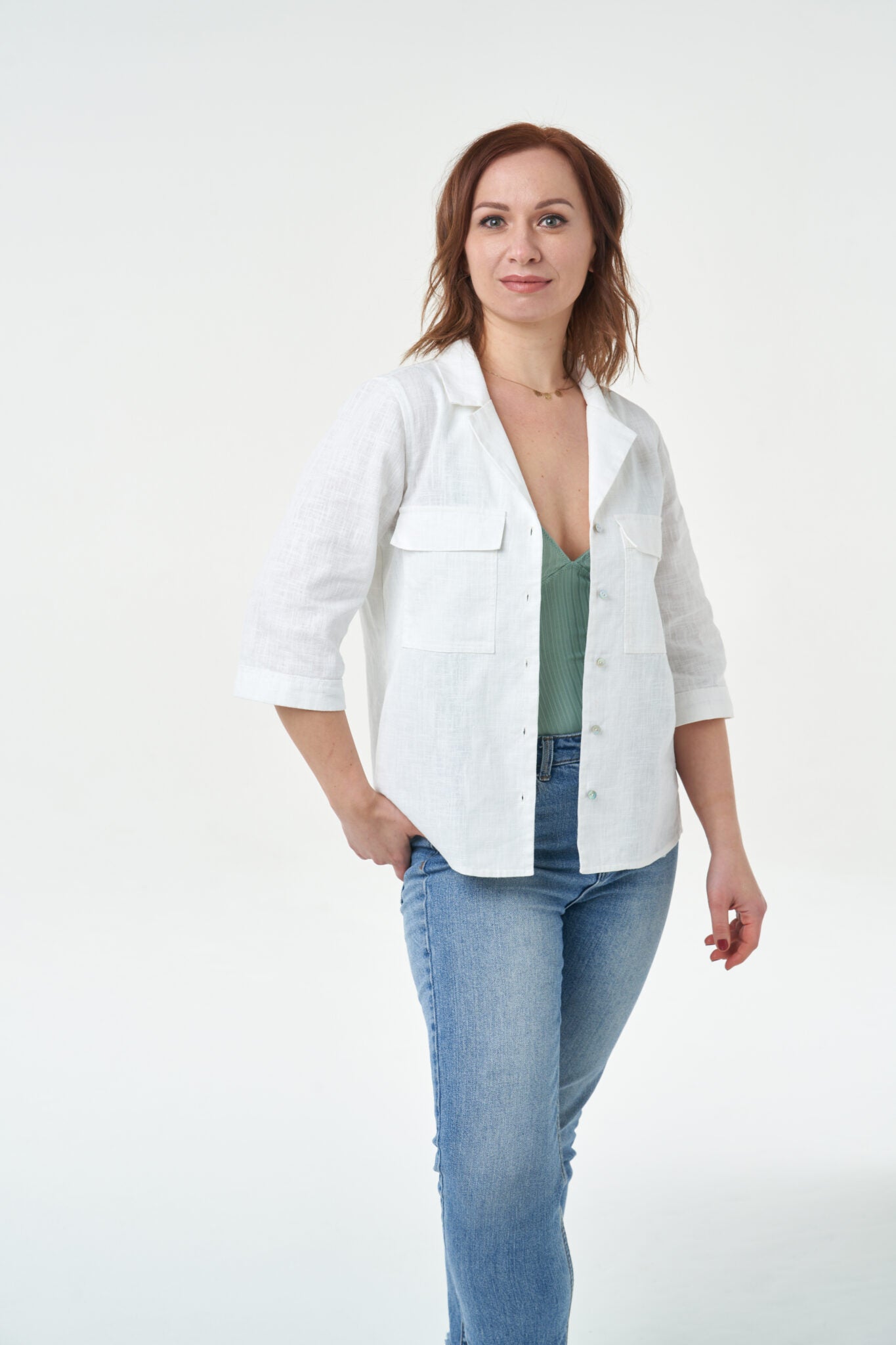 Woman wearing the Jodie Shirt sewing pattern from Sew Over It on The Fold Line. A shirt pattern made in linen, linen blends, chambray, cotton shirting or poplin fabrics, featuring a revere collar, partial collar stand, elbow-length cuffed sleeves, split h