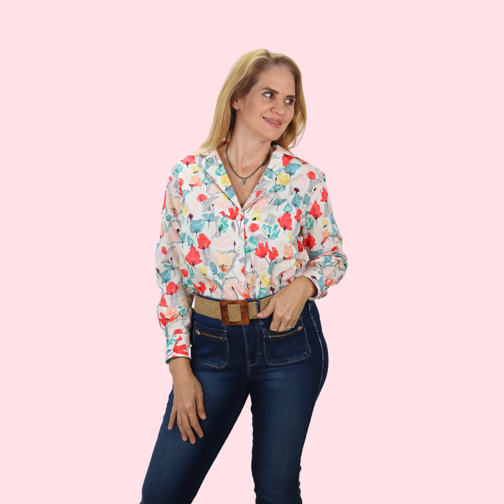 Woman wearing the Juany Shirt sewing pattern from Sirena Patterns on The Fold Line. A shirt pattern made in linen, cotton, cotton blends, chambray and poplin fabrics, featuring a loose-fit, button-front, collar, back yoke with pleat, long sleeves with pla