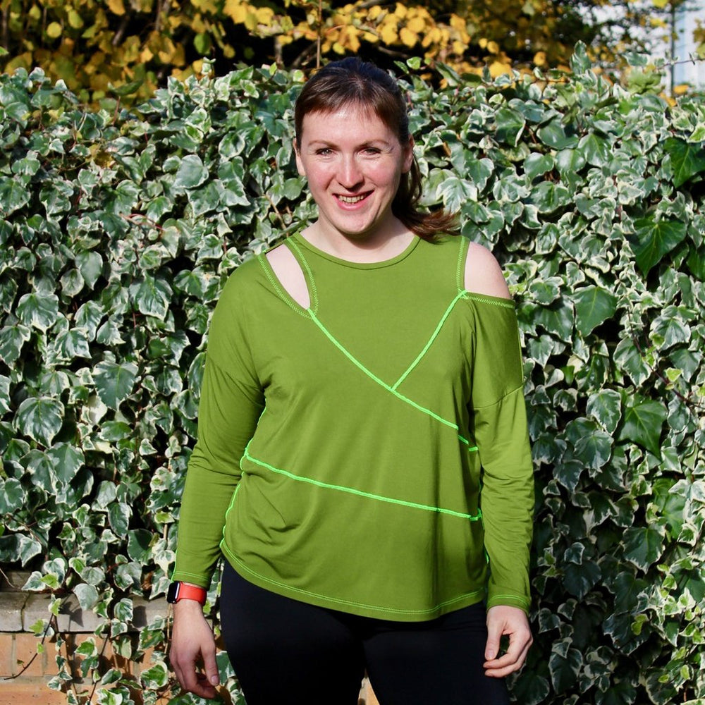 Woman wearing the Kinetic Tee sewing pattern from Fehr Trade on The Fold Line. A T shirt pattern made in bamboo jersey, merino wool jersey, ponte jersey, or lightweight sweatshirting fabric, featuring a loose-fitting asymmetric silhouette, slash openings 