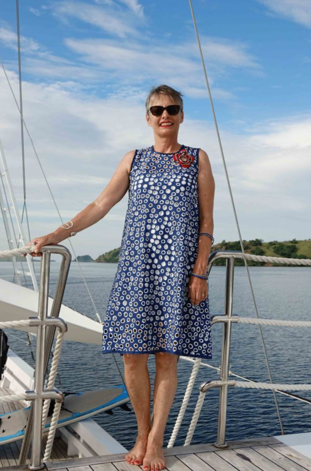 Woman wearing the Komodo Triangle Dress sewing pattern by Alice and Co Patterns. A sleeveless, dress pattern made in any weight of fabric, stiffer fabrics will emphasise the cone-like shape, whilst lighter weights will give you more swish, featuring a bia