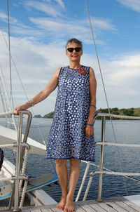 Woman wearing the Komodo Triangle Dress sewing pattern by Alice and Co Patterns. A sleeveless, dress pattern made in any weight of fabric, stiffer fabrics will emphasise the cone-like shape, whilst lighter weights will give you more swish, featuring a bia