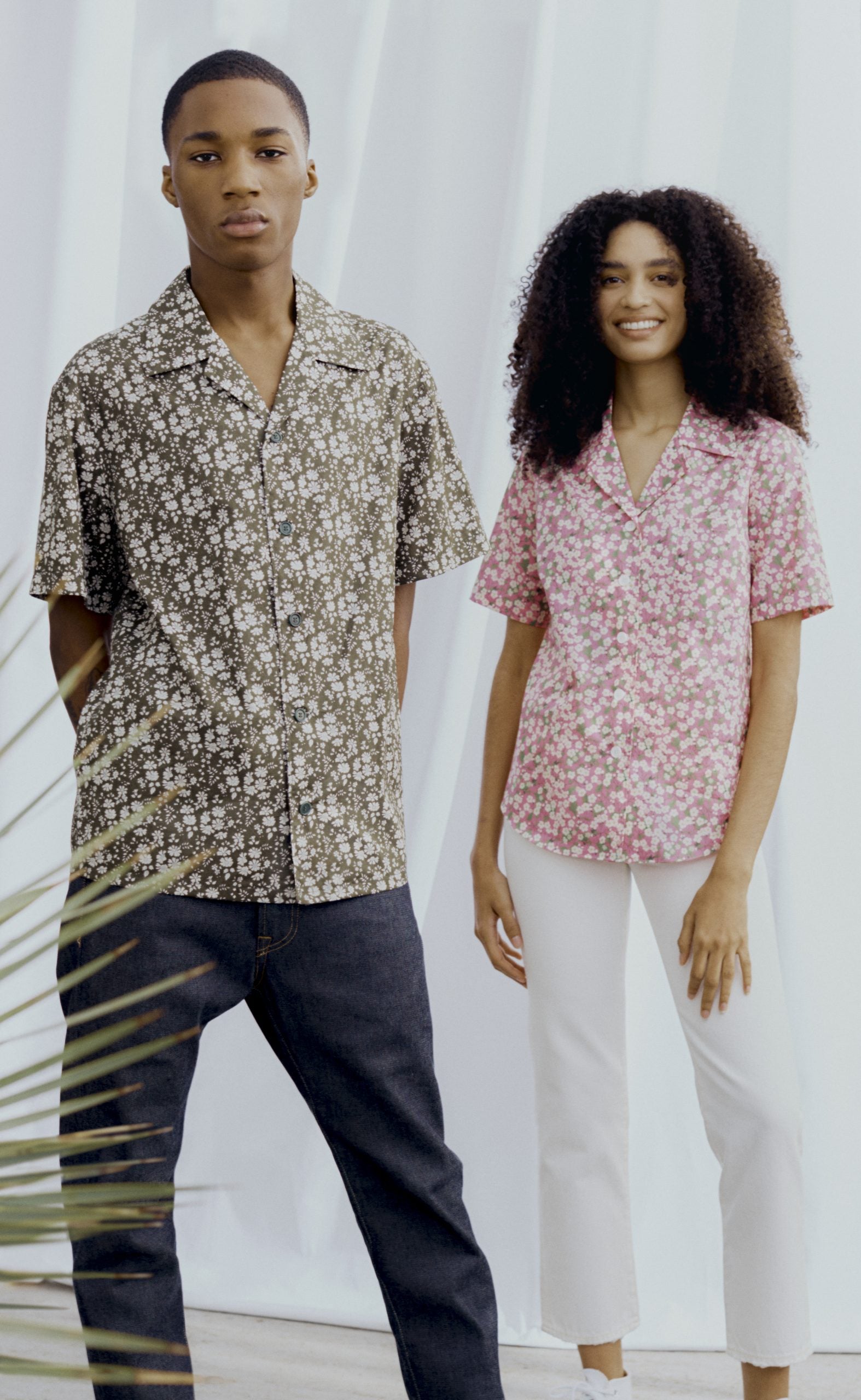 Man and Woman wearing the Unisex Como Collar Shirt sewing pattern from Liberty Sewing Patterns on The Fold Line. A shirt pattern made in lawn cotton, chambray, silk or linen fabrics, featuring a back yoke, optional bust darts and pockets, short sleeves, c