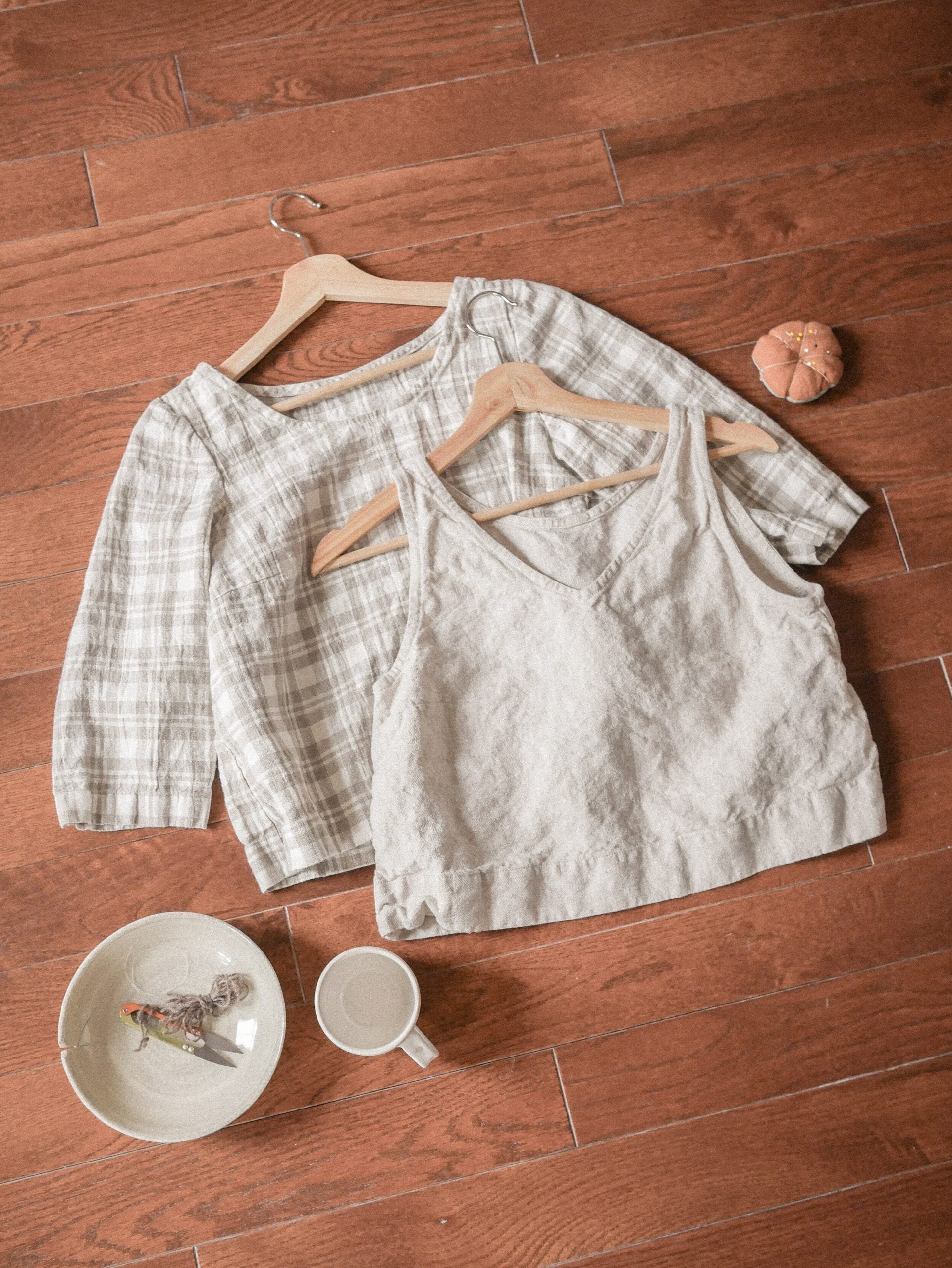 Photo of the Laurence Top sewing pattern from Vivian Shao Chen on The Fold Line. A top pattern made in linen or cotton fabric, featuring a v-neck sleeveless option and a scoop neck 3/4 sleeve option, both with a cropped length.
