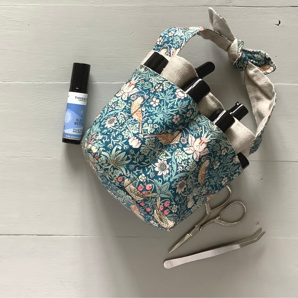 Photo showing the Lily Mini Tote Basket sewing pattern from Lasenby on The Fold Line. A tote basket pattern made in canvas, linen, Tana lawn, quilting cotton, twill, and thin tweed fabrics, featuring multiple outside pockets, centre pocket for mason jar, 